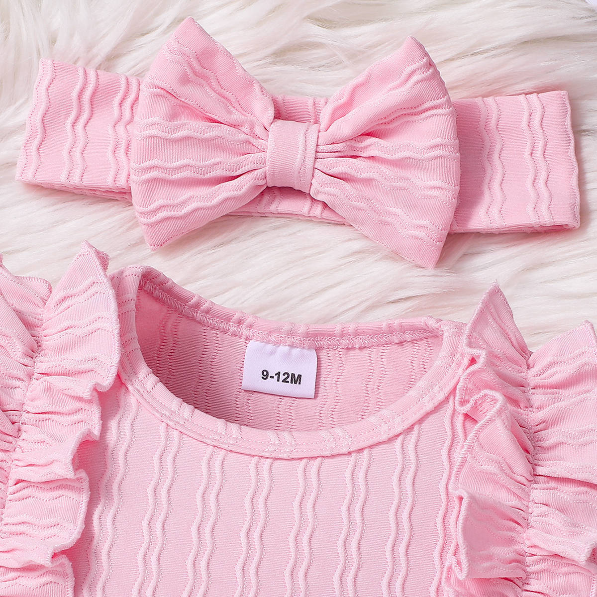 ヘッドスカーフのリボンディテールが見えるベビー用アクセサリーアップ画像