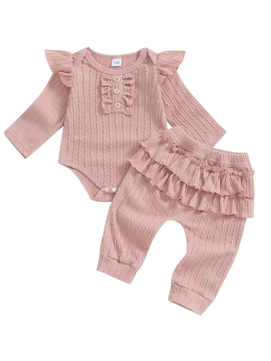 ピンクニットの長袖スナップ付きトップスとフリル付きロングパンツのベビー女の子上下セット全体
