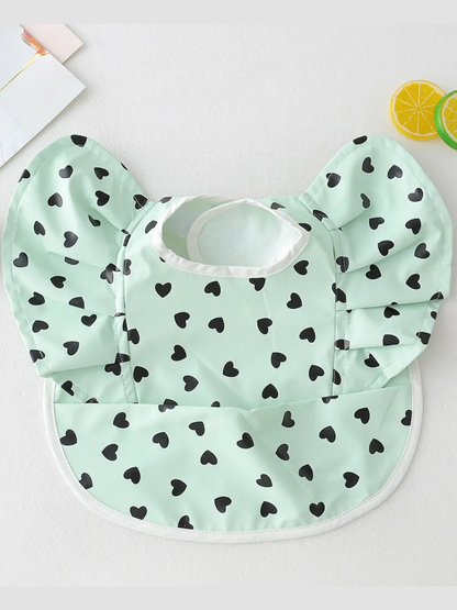 ベージュオリーブリーフ柄の防水PUレザーお食事ビブ 食べこぼしポケットで後片付けラク（お食事ビブ）
