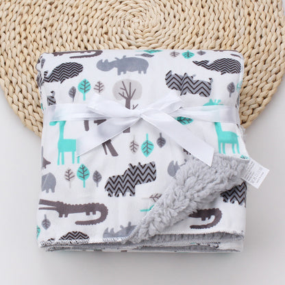 グレー地にミントカラーのアニマル柄が入ったコーラルフリース ベビーブランケット（ベビー毛布）を広げて見せた写真
