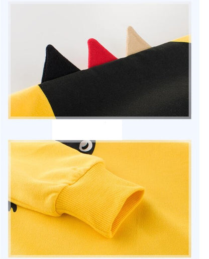 横から見た恐竜の背びれ部分が立体的になっているイエロートレーナー
