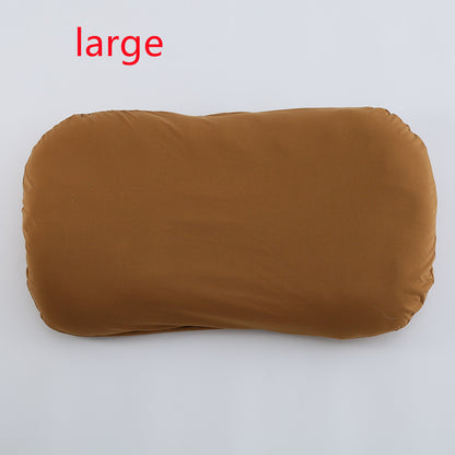 箱から取り出したベビーベッド本体をベッドの上に広げた開封イメージ写真
