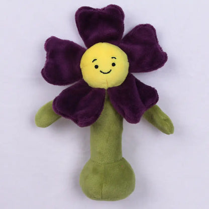 紫の花びらと黄色い顔が特徴のフラワーBIBIぬいぐるみラトルの正面画像  
