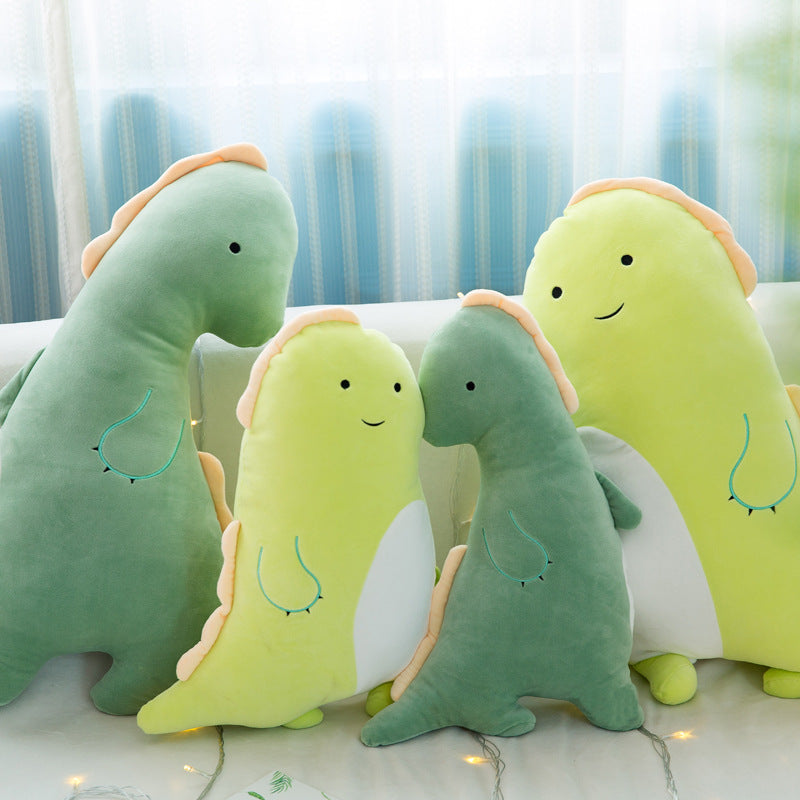 ベッドの上に置かれたカップルダイナソー抱きまくらとフェイクグリーンのインテリア
