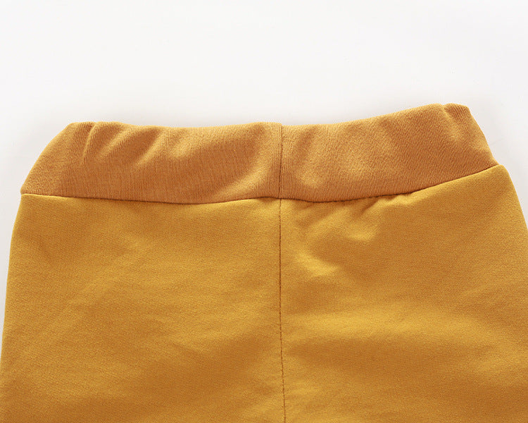 目のプリントがポイントの子ども用コットンスウェットトップスとパンツセット
