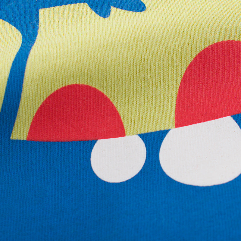 恐竜カートゥーン柄プリントのアップ デザイン部分のディテール
