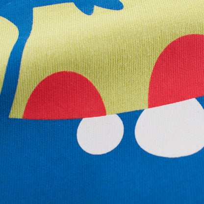 恐竜カートゥーン柄プリントのアップ デザイン部分のディテール
