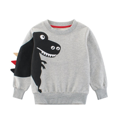 グレーカラーの恐竜プリントトレーナーをハンガーにかけた画像

