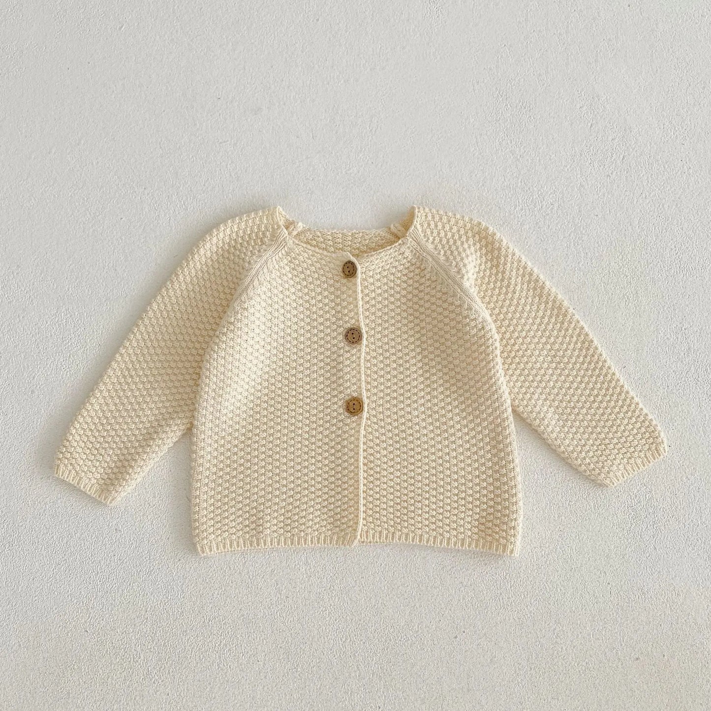 シンプルな編み目がきれいなコットンニット生地の質感クローズアップ写真
