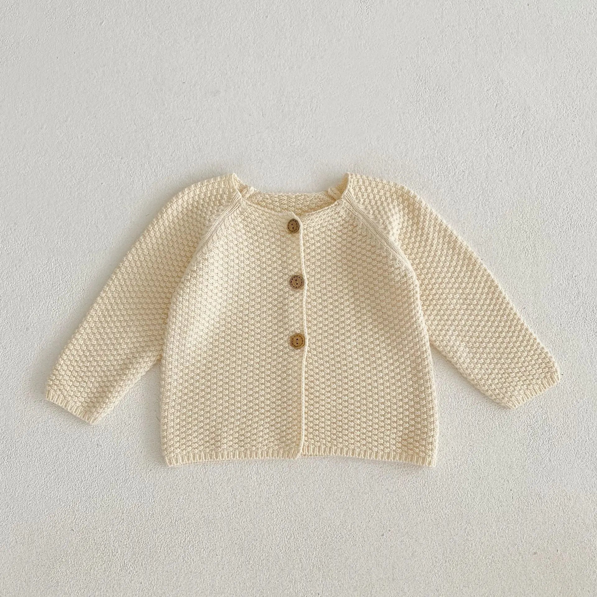 シンプルな編み目がきれいなコットンニット生地の質感クローズアップ写真
