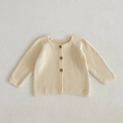 シンプルな編み目がきれいなコットンニット生地の質感クローズアップ写真
