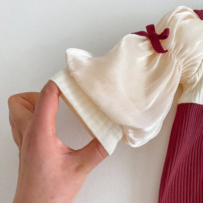 上品アプリコットで特別感をまとう 女の子ベビーロンパース リボンデザイン 長袖 コットン クラスA 66~90cm