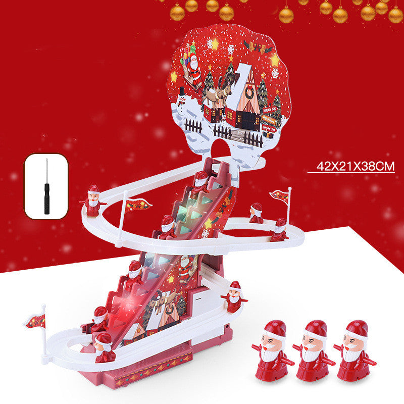 机の上に置かれたサンタ階段トラックおもちゃのサイズ感が分かる写真
