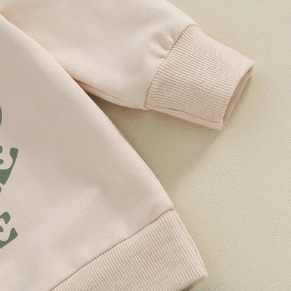 アプリコットカラーの長袖トップスとパンツの2点セット全体写真
