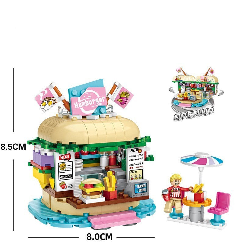 ハンバーガー型の屋根が特徴のミニブロックショップセット。カウンター、メニュー看板、フライドポテトやバーガーパーツ、旗飾り、テラス席、パラソルテーブル、人形フィギュア付き。幅8cm×高さ8.5cmのコンパクトサイズで、創造力を育む知育ビルディングトイ。
