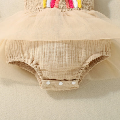 アプリコットのボトム一体型デザインとスナップボタン部分のディテール
