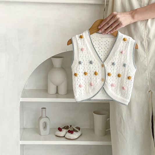 クリームホワイトのベビーコットンニットベスト正面写真
