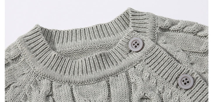 長袖コットンロンパースを着た赤ちゃん
