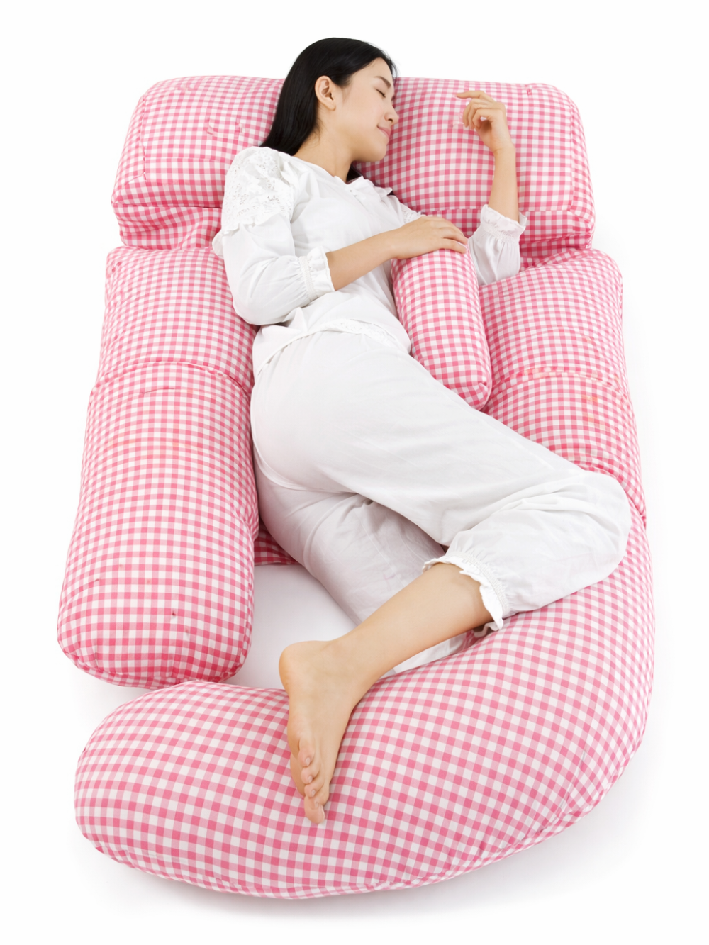 ピンクのG字型マタニティ抱き枕を抱えて横向き寝する使用イメージ
