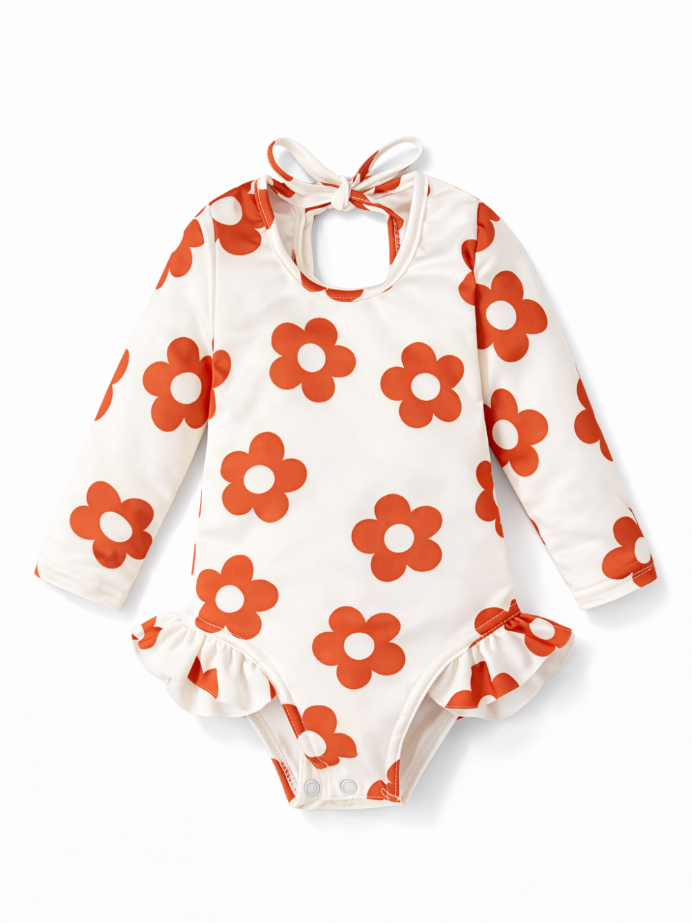 ベージュ地にオレンジの花柄が入った、長袖のベビー用ロンパース（首元リボン付き）を白背景で撮影した商品画像。
