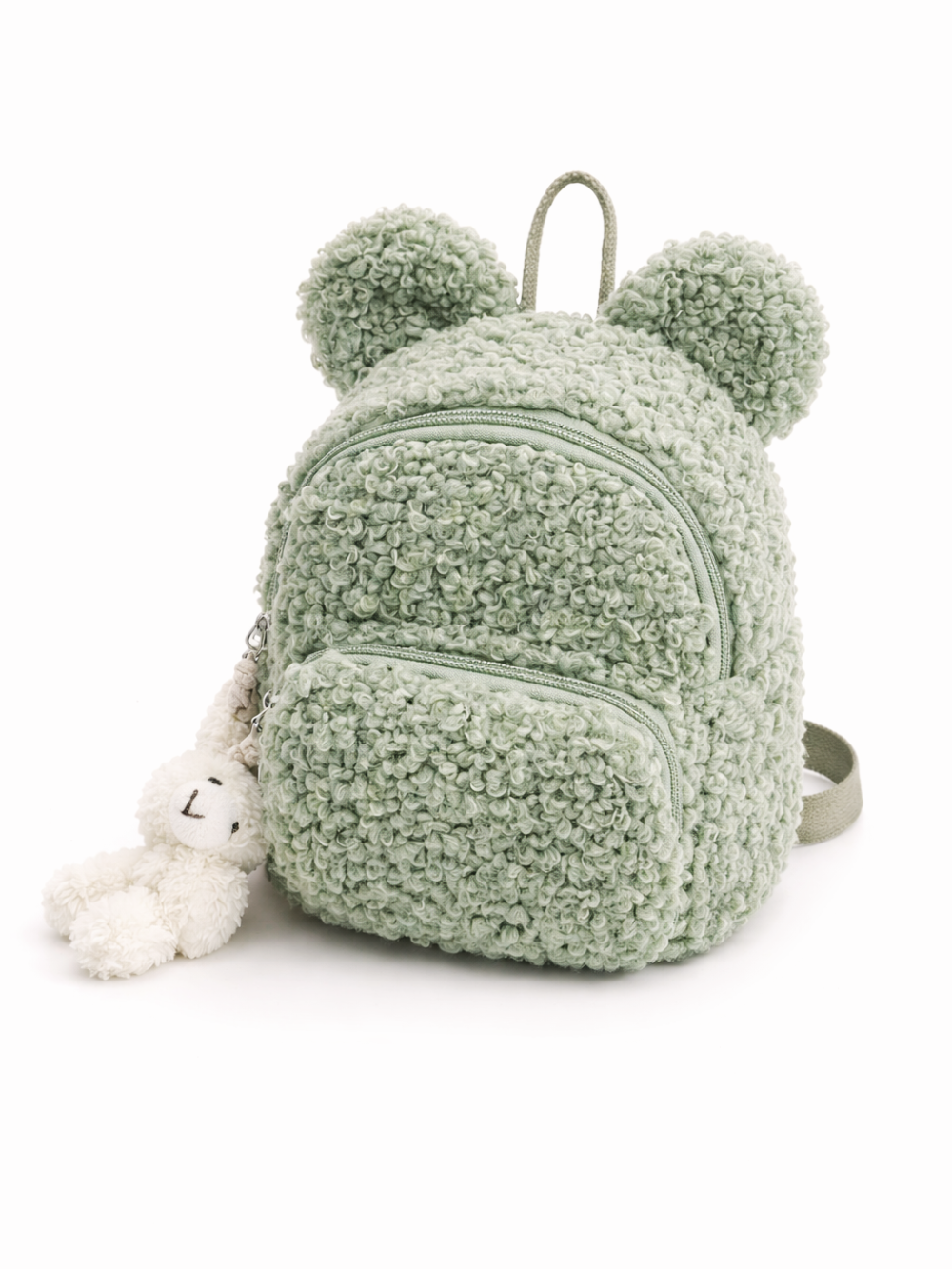 リボン風の耳が付いた、もこもこ素材のセージグリーンのベビー用ミニリュック。白背景で正面から撮影。
