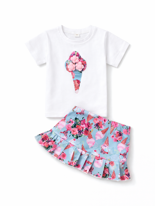 白い半袖Tシャツ（アイスクリームのアップリケ付き）と、水色ベースに花柄とアイス柄が入ったフレアスカートの女の子用2点セットを、白背景に並べた商品画像。