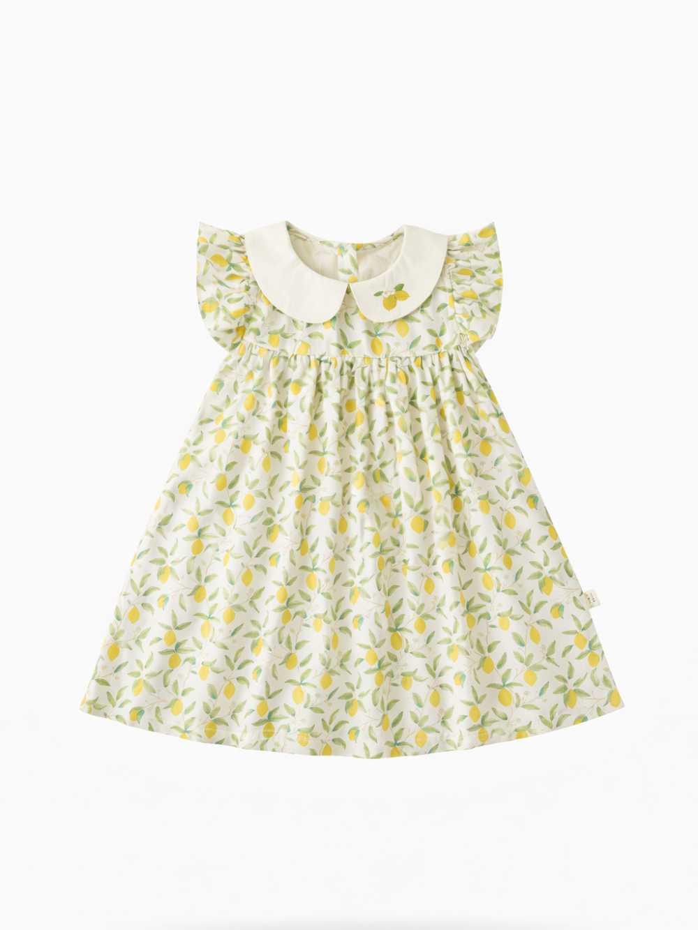 レモン柄のプリントが入った子ども用ワンピース。フリル袖と丸襟（襟元に小さなレモン刺繍付き）のデザインで、白い背景に正面から平置きで撮影されている。