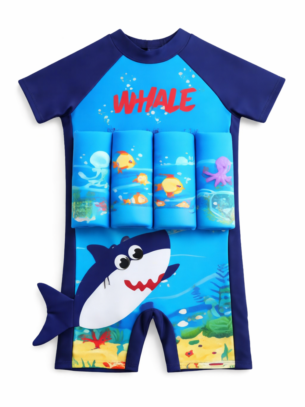白背景に置いた子ども用フロート付きスイムスーツ。ネイビーの半袖とサイド切替、鮮やかなブルーの身頃に「WHALE」ロゴと海のイラスト、前面に浮力パッドが付き、下部に大きなサメのデザインと立体しっぽがある。
