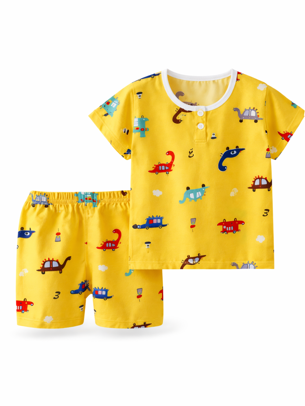 子ども用半袖トップス＆ショートパンツの2点セット。イエロー地に恐竜や乗り物の総柄プリント。白背景のスタジオ撮影で、トップスとパンツを並べて見せている。
