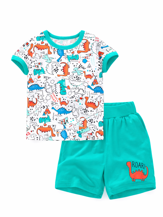 白背景で撮影したキッズ用Tシャツ＆ショーツの2点セット。恐竜柄プリントの白い半袖Tシャツと、ターコイズ色のショートパンツ（「ROAR」恐竜モチーフ入り）が並んでいる。
