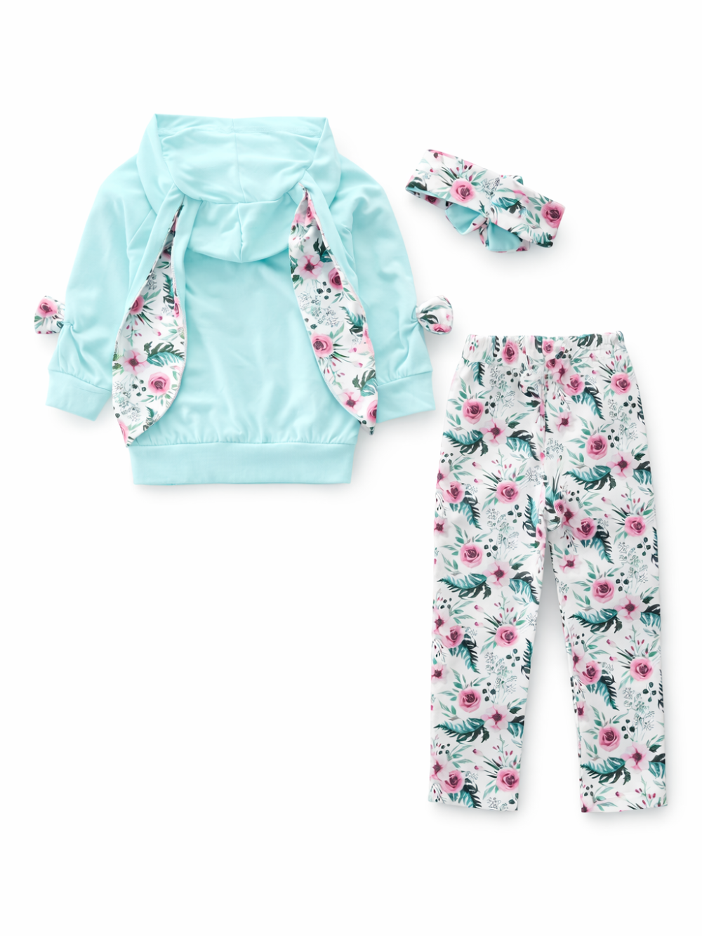 白背景のスタジオ撮影で、キッズ用3点セット（ミントブルーのフード付きトップス、ピンク系フラワー柄レギンス、同柄ヘアバンド）が平置きで配置されている。トップスは内側に花柄の切り替えがあり、やわらかな影が入っている。
