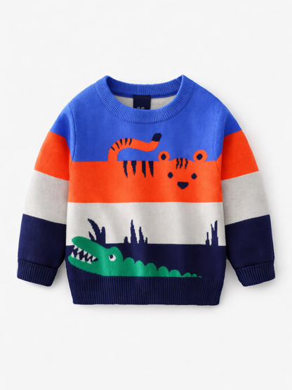 白背景のスタジオ撮影。青・オレンジ・グレー・ネイビーの配色に、虎とワニのイラストが入った子ども用ニットセーター（長袖）。
