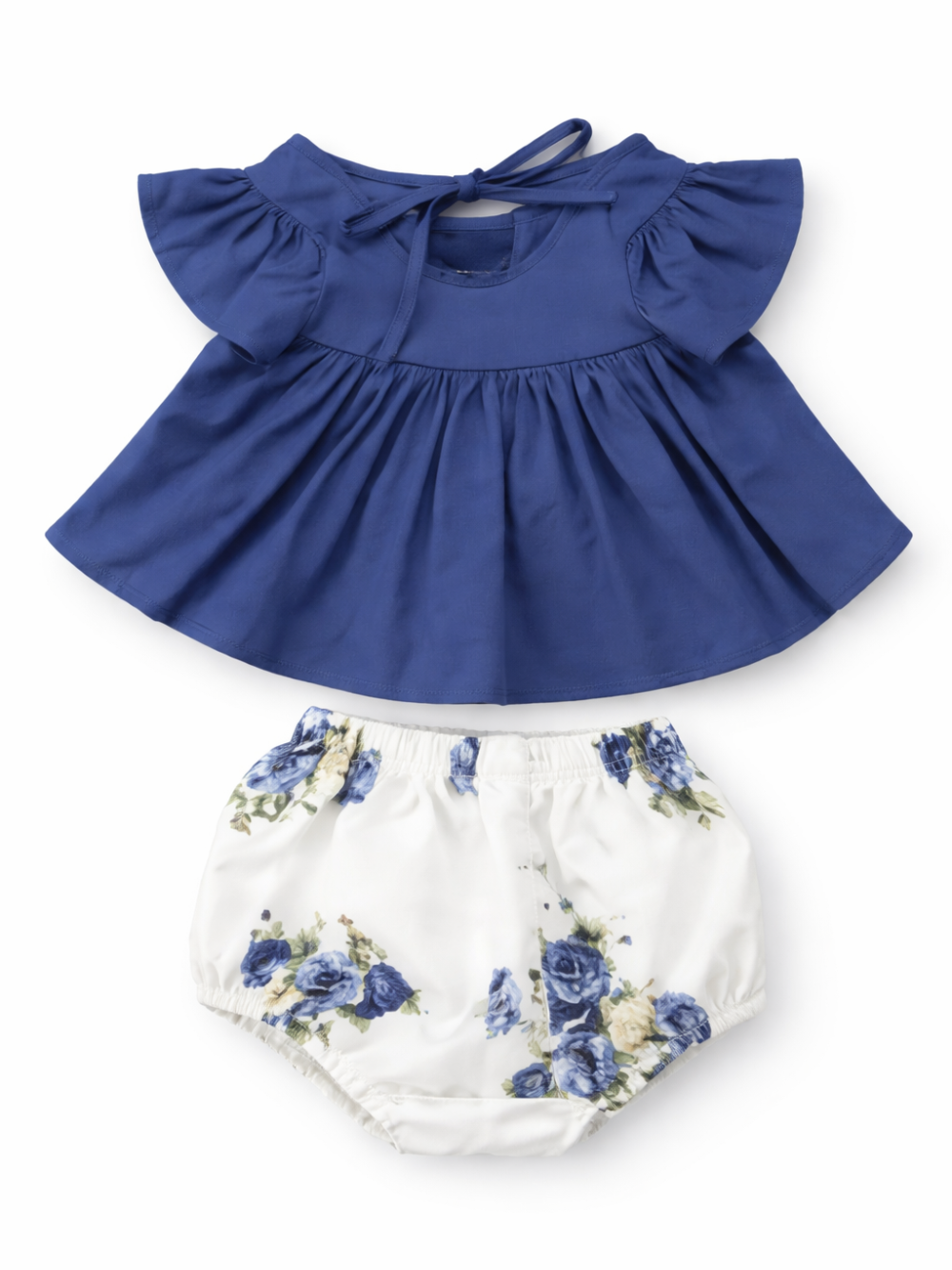 ネイビーのフリル袖トップスと、ブルー系フラワープリントの白いブルマ（かぼちゃパンツ）のベビー用2点セット。フラットレイで全体の形とディテールが分かる商品画像。