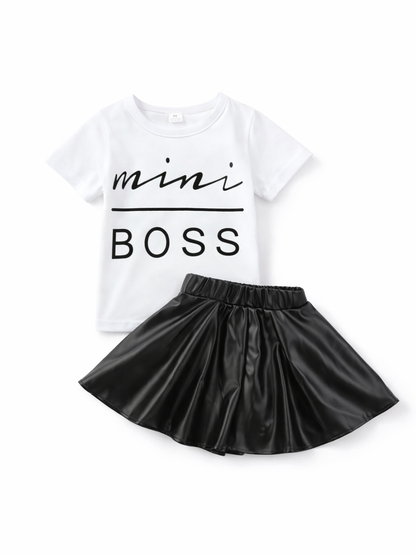 白い「mini BOSS」ロゴ入り半袖Tシャツと黒のフェイクレザーフレアスカートの子ども用2点セット（白背景・平置き）