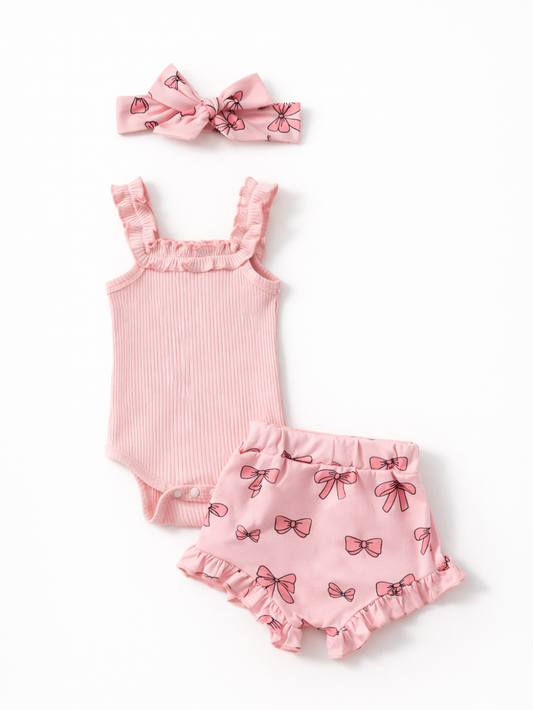 ピンクのフリルロンパースとリボン柄ショートパンツとヘアバンドのセット 全体
