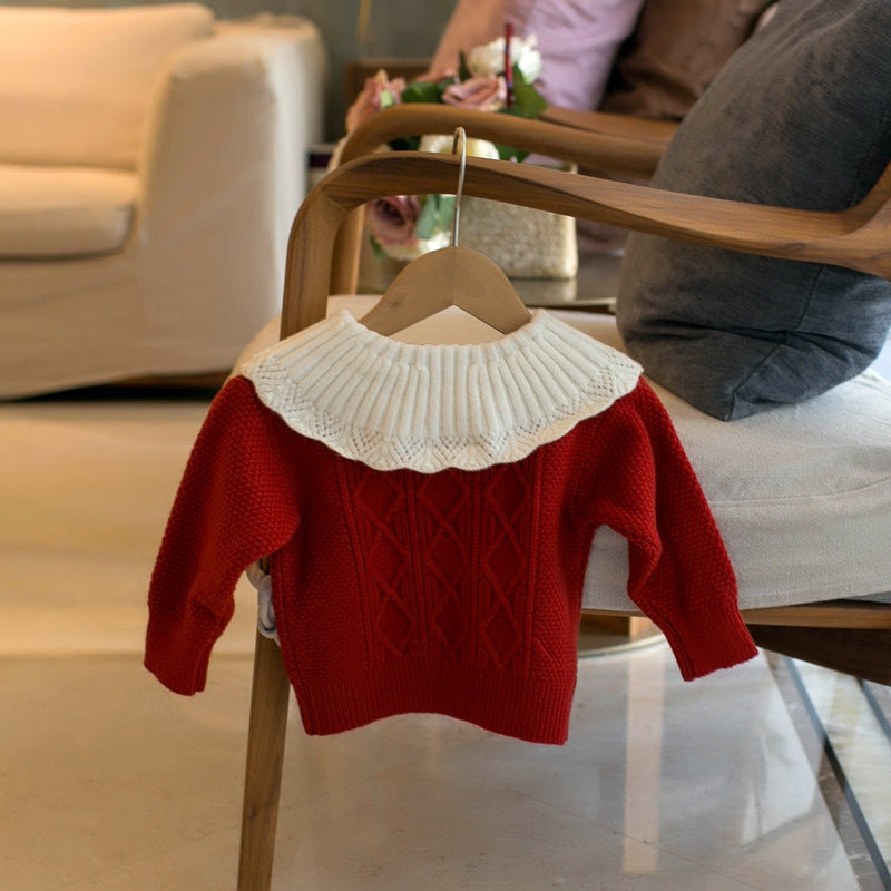 オフホワイトの花刺繍ベビーセーター
