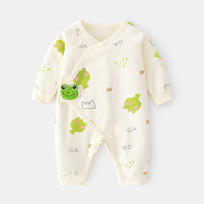 ベージュ地にグリーンのカエルプリントをちりばめたコットン長袖ロンパース

