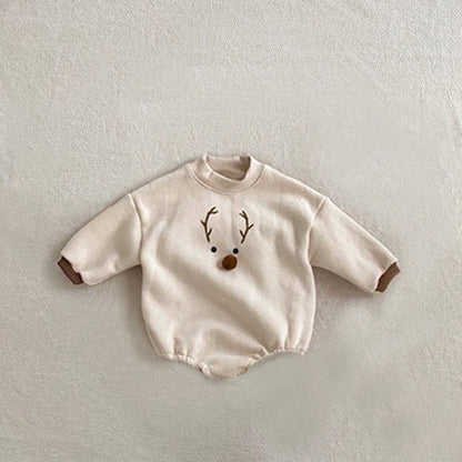 赤ちゃんが着用するクリスマス風ロンパース
