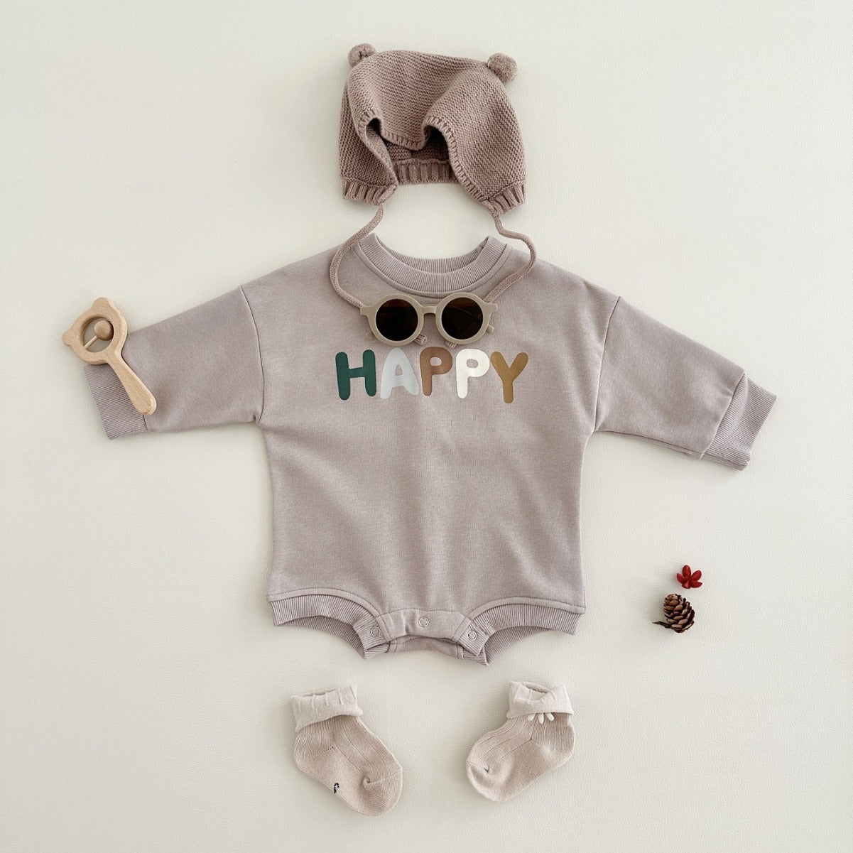 アプリコットカラーのクリスマスボディスーツ正面写真