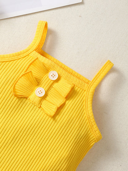 イエローのボディスーツ胸元ディテール ボタン風デザイン
