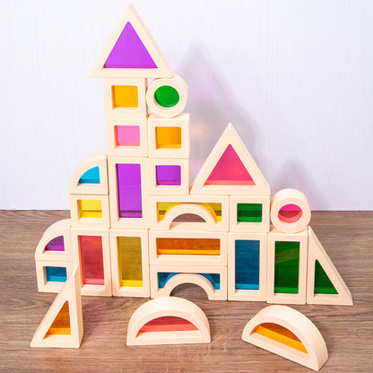 虹色アクリル入り木製積み木で高く組み上げた塔と城の作例
