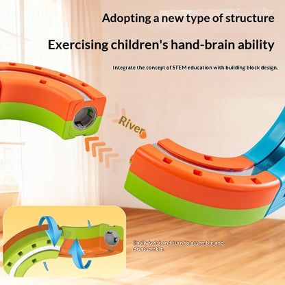 橋とトンネルがあるマグネットレールコースを走行する電動カー
